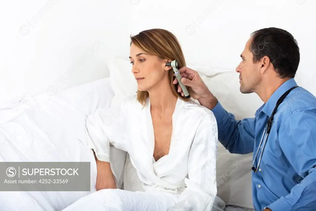 Woman doctor ear auscultation