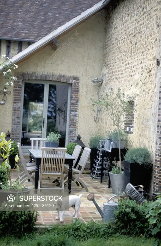 Farmhouse terrace with table and chairs