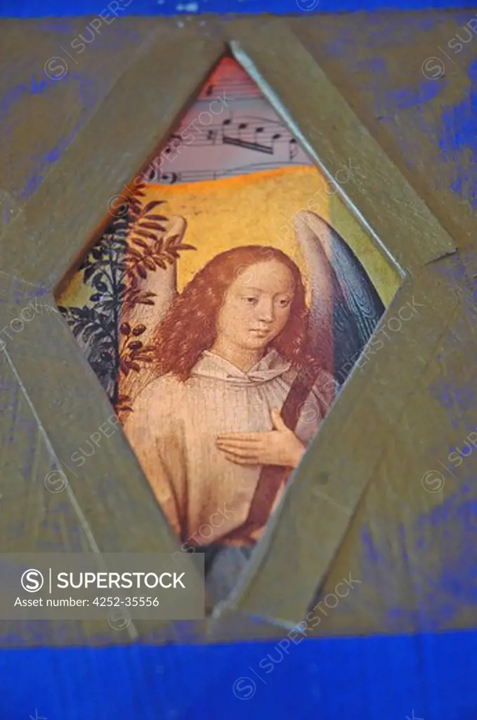 FRame religious paint of an angel near an olive tree