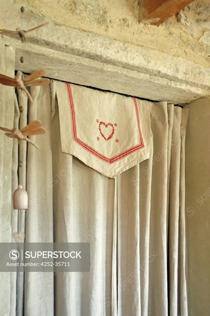 Natural linen curtain in front of a cellar door