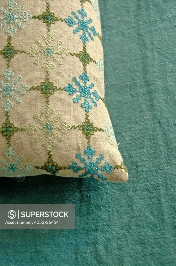Close up of an embroidered hemp fabric cushion