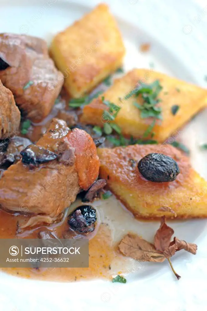 Sauteed beef with olives and polenta