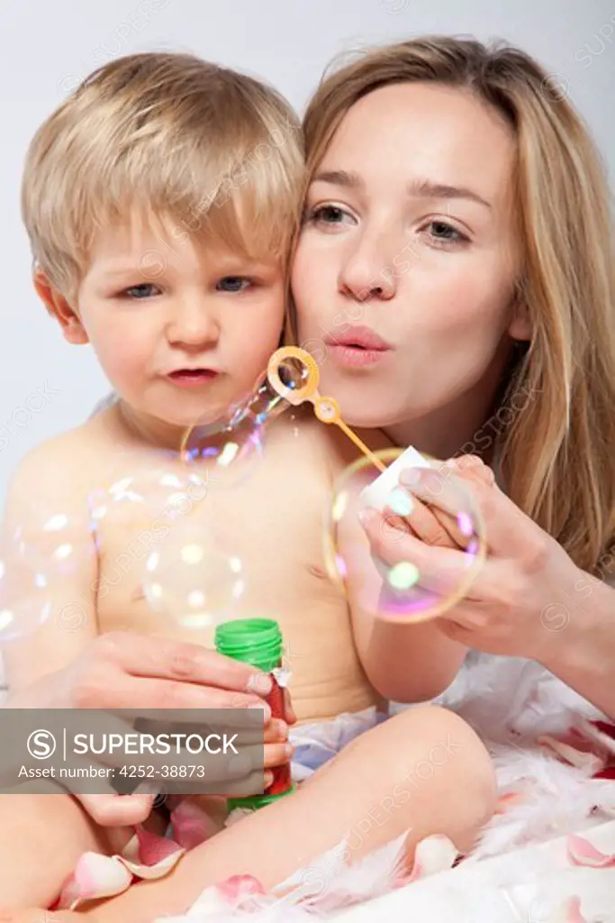 Woman child soap-bubbles