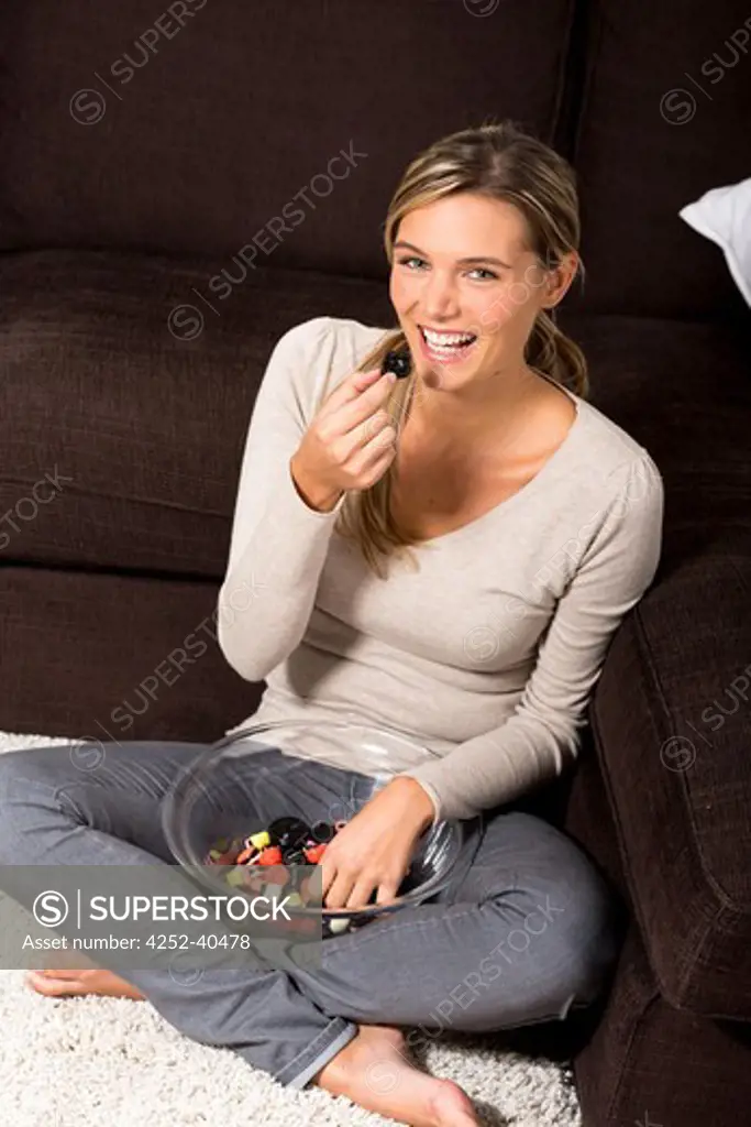 Woman candies nibbling