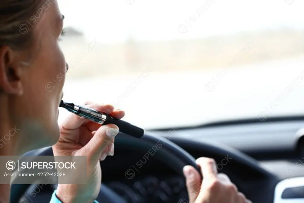Woman car electronic cigaret
