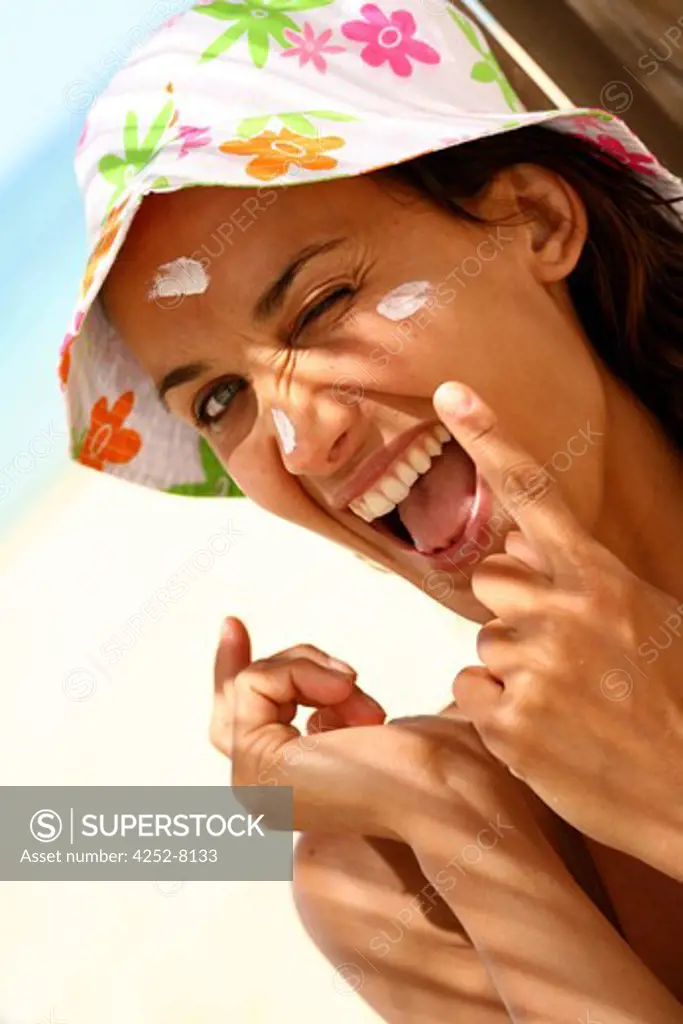 Woman sunscreen cream and face