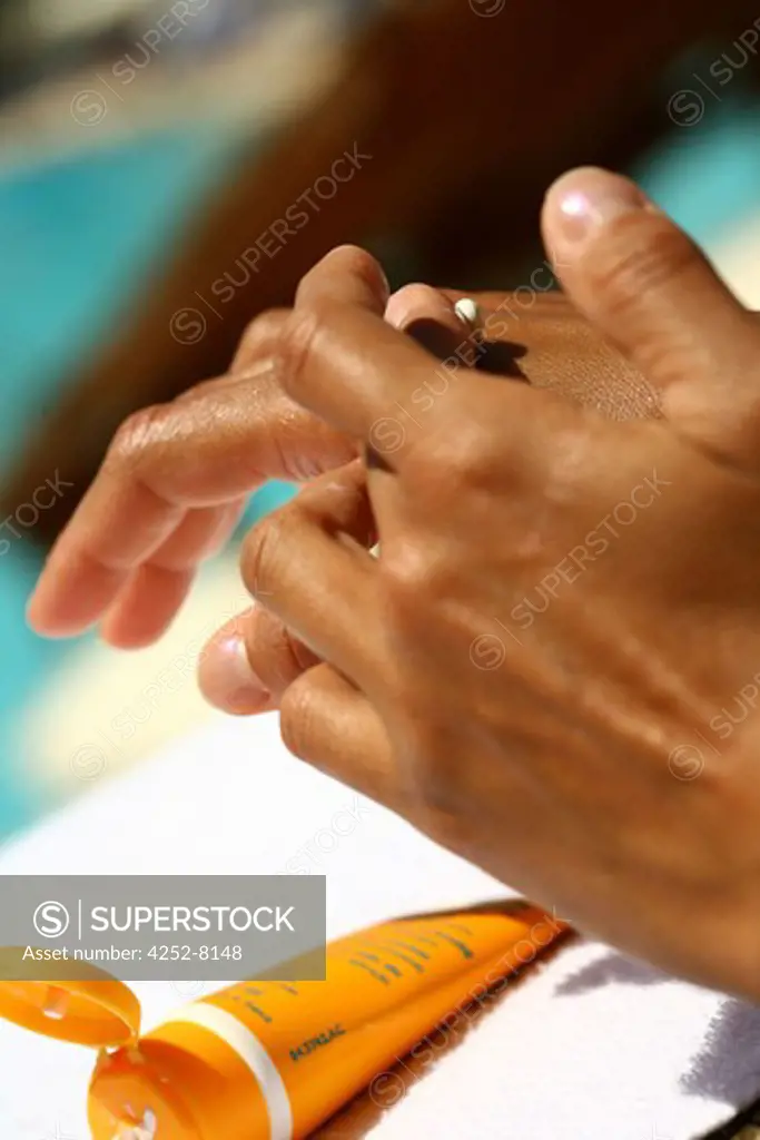 Woman sunscreen cream and hands