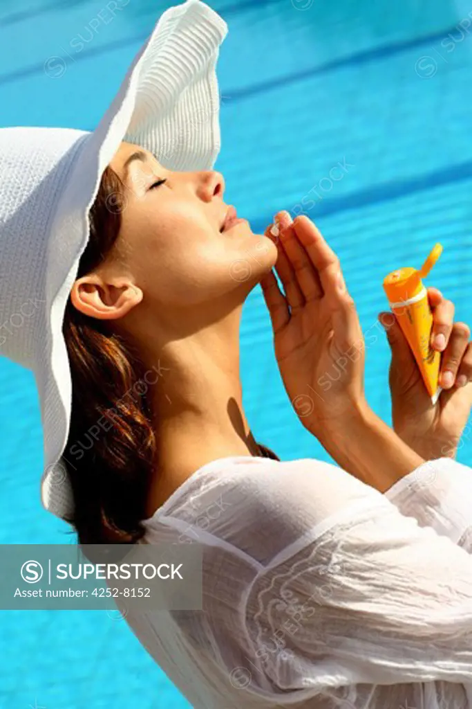 Woman sunscreen cream and face