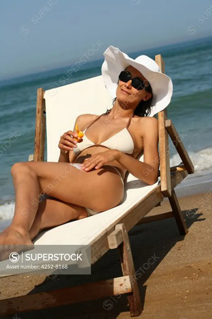 Woman beach and sunscreen cream