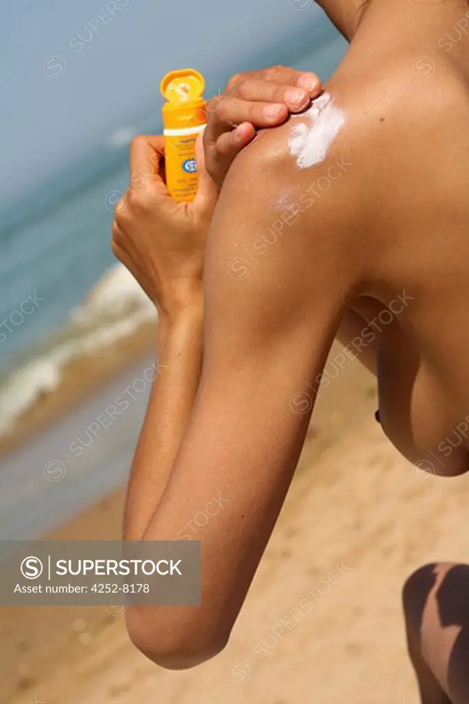 Woman beach and sunscreen cream