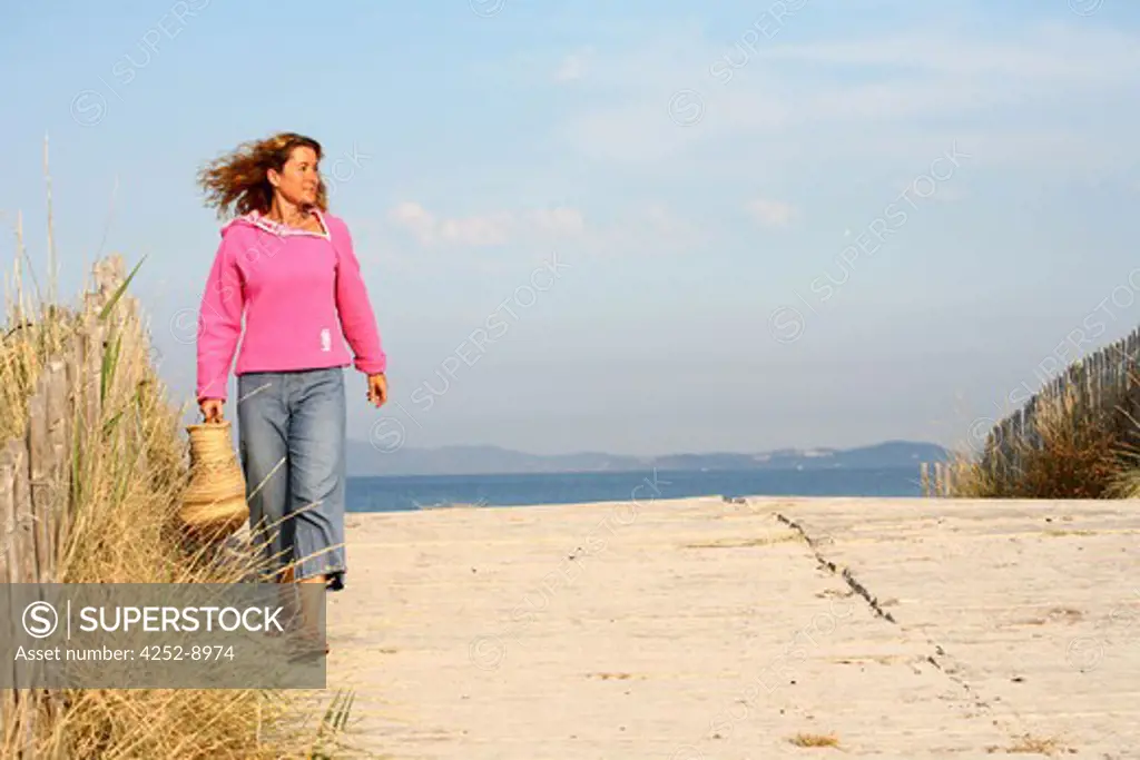 Woman walk beach