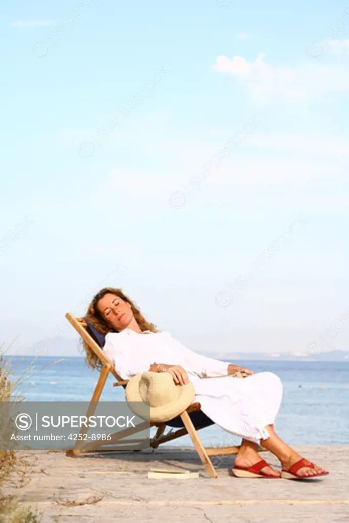 Woman beach deckchair