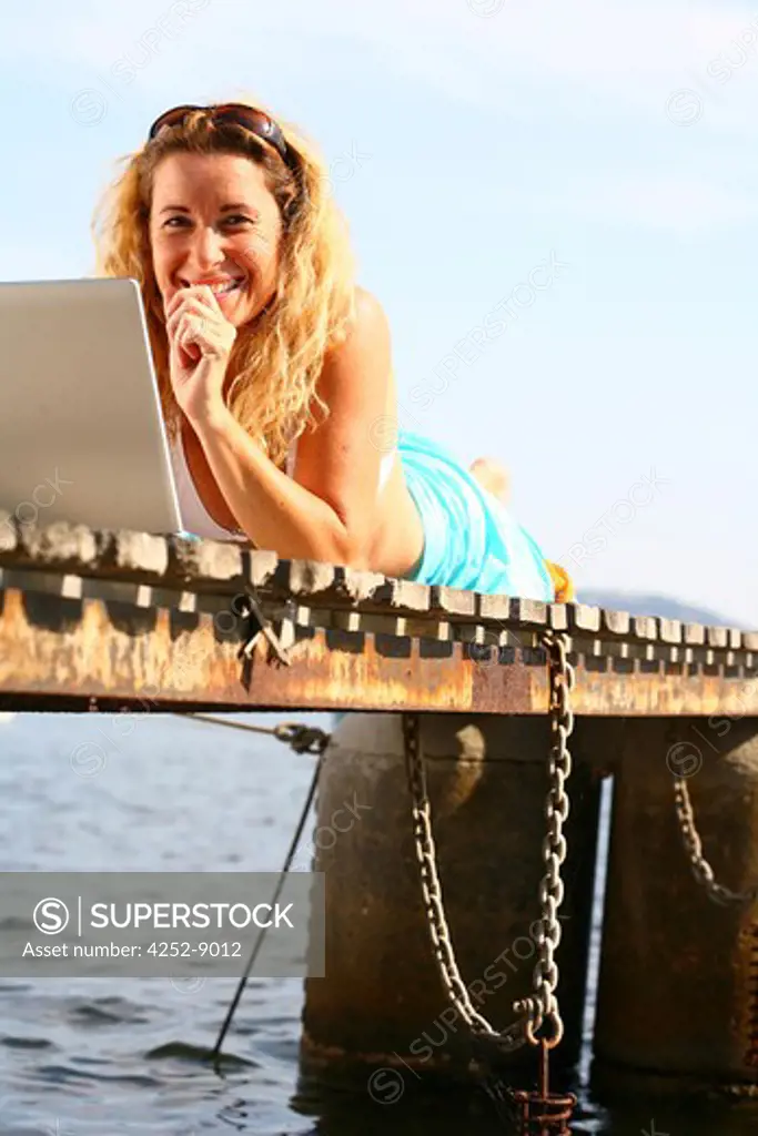 Woman beach computer