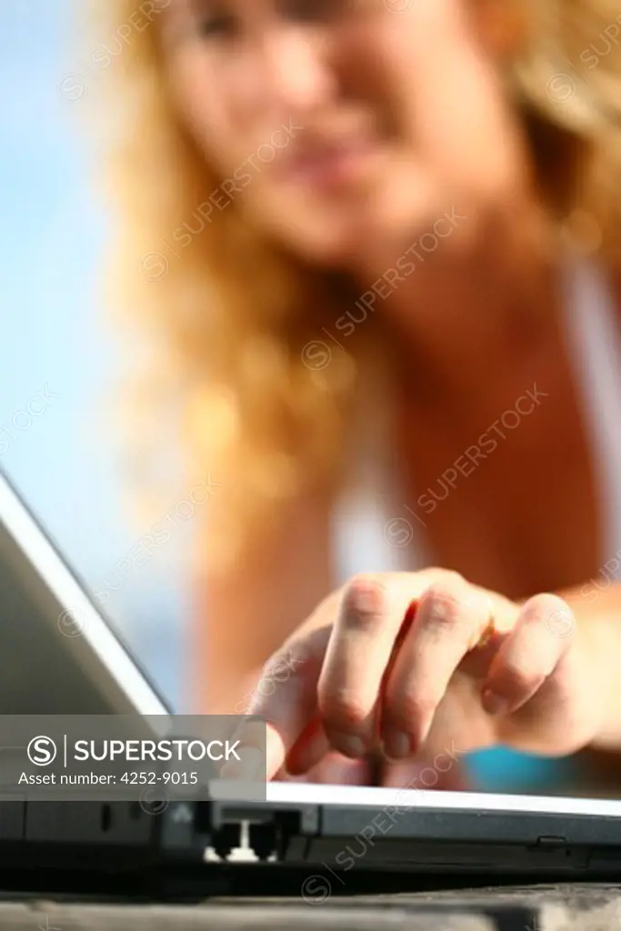 Woman beach computer