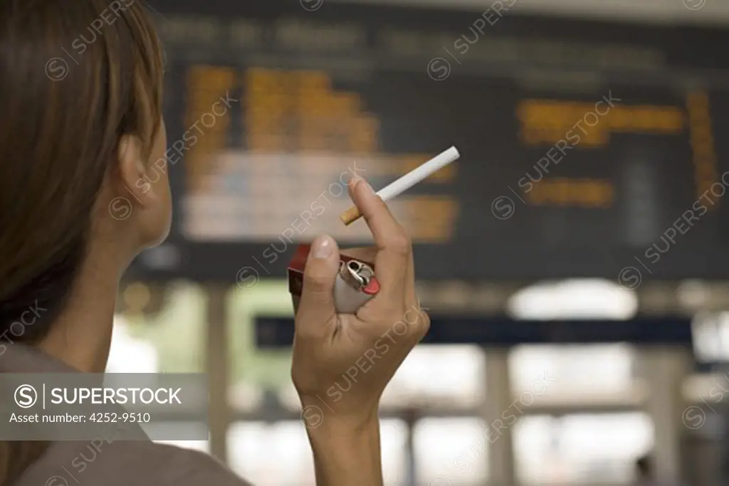 Woman train station cigaret