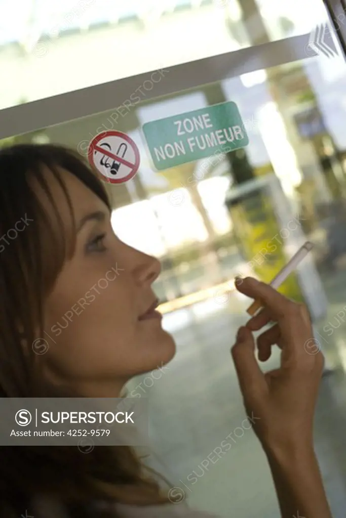 Woman airport tobacco