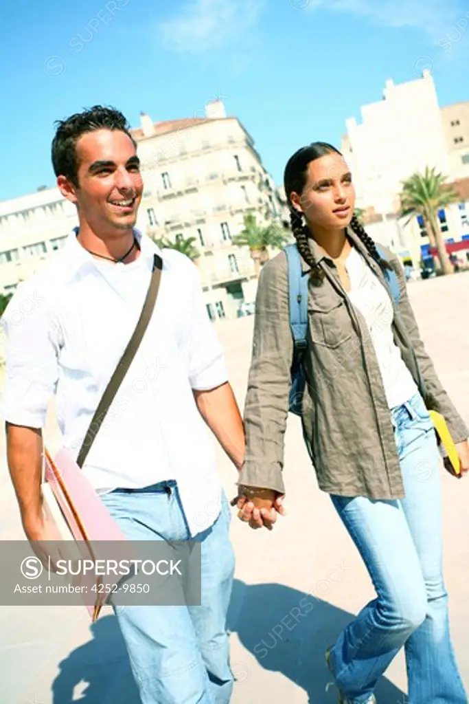 Teenage couple walk