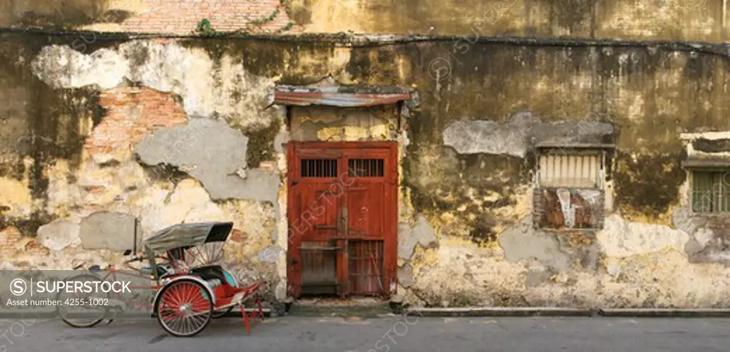 Malaysia, Penang, George Town, Panoramic image of old red door and trishaw