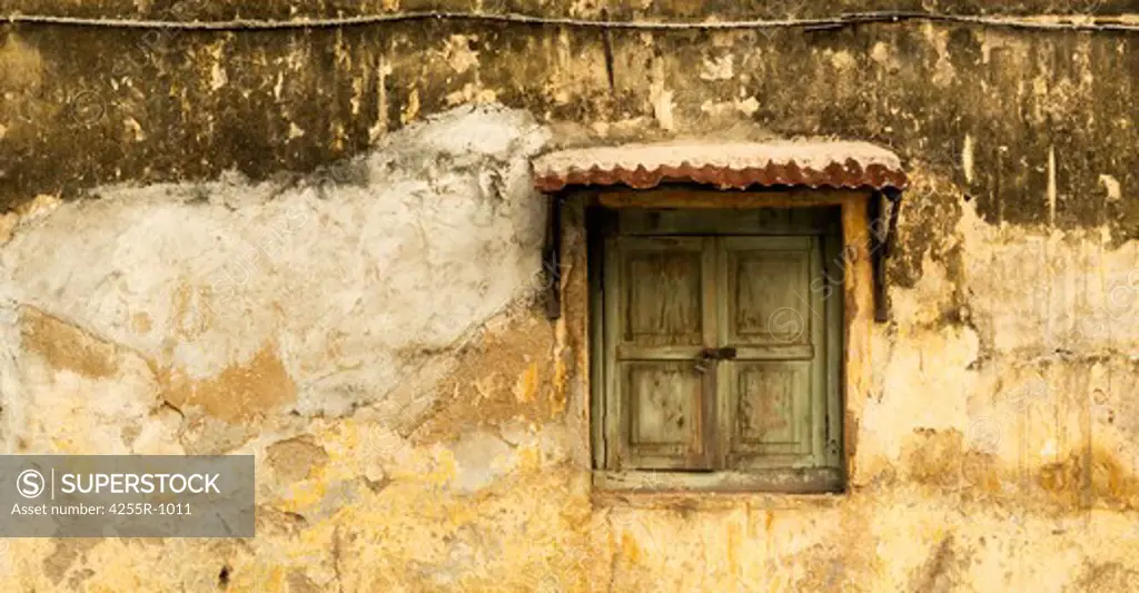 Malaysia, Penang, George Town, Panoramic image of old green window and yellow wall