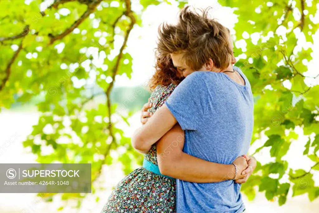 Romatic couple embracing outside