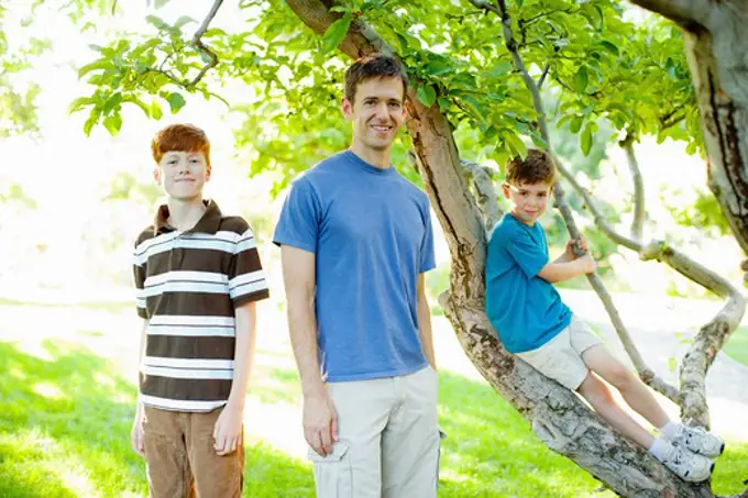Father and sons in garden