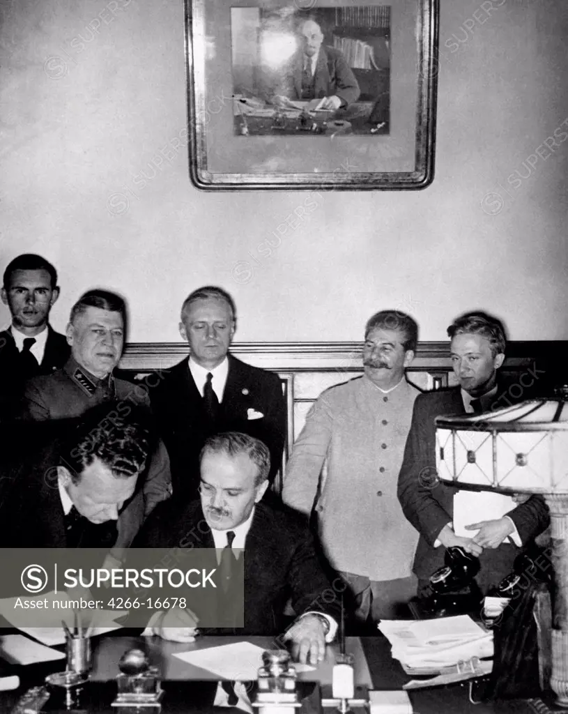Soviet Foreign Minister Molotov signs the German-Soviet nonaggression pact (Behind: Joachim von Ribbentrop and Joseph Stalin) by Anonymous  /State Museum of History, Moscow/1939/Photograph/Russia/History