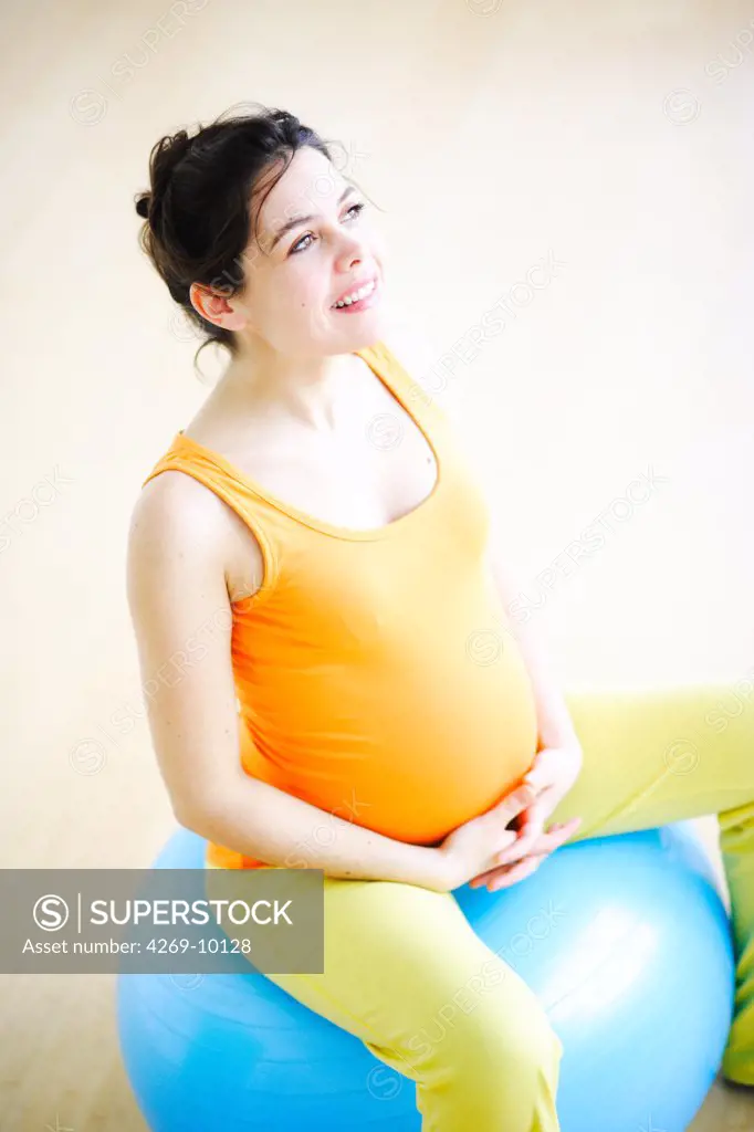 Pregnant woman performing prenatal exercises.