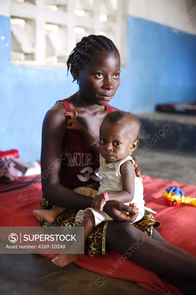 Undernourished child with his mother in a therapeutic feeding center in Monrovia, Liberia, implemented by Action contre la Faim (ACF), an international non-governmental organisation (Action against Hunger). These centers give malnourished people (especially children) nutritional and medical care.