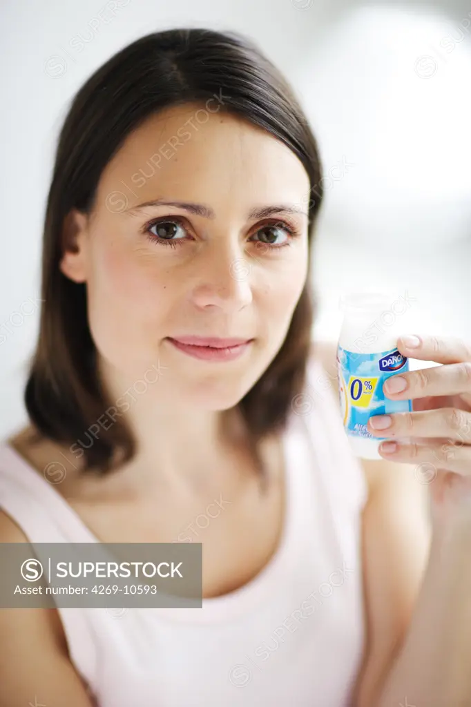 Woman taking a fat free functional food or pharmafood.