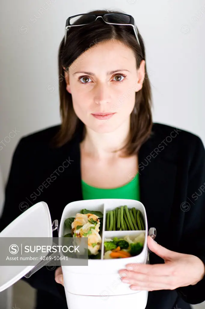 Business woman with lunch box.