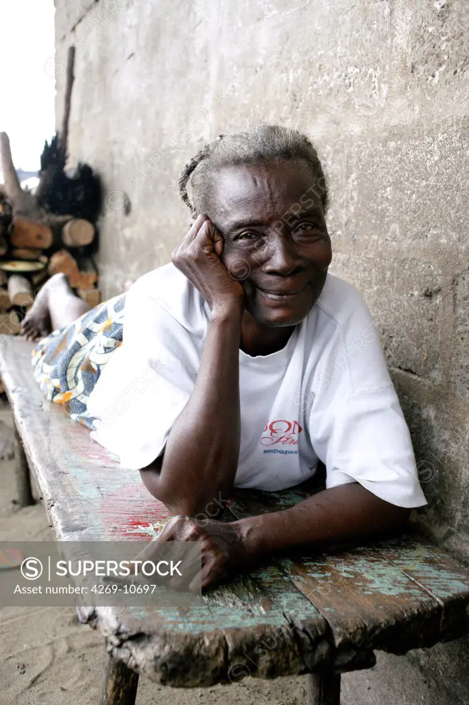 Elderly woman resting in the family house of a poor area of Monrovia (WestPoint shantytown), Liberia.