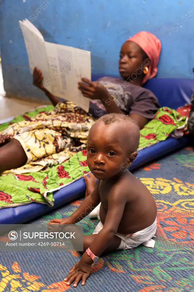 Woman with her child suffering from malnutrition in a Therapeutic Feeding Center in Monrovia, Liberia, implemented by Action contre la Faim (ACF), an international non-governmental organisation (Action against Hunger).