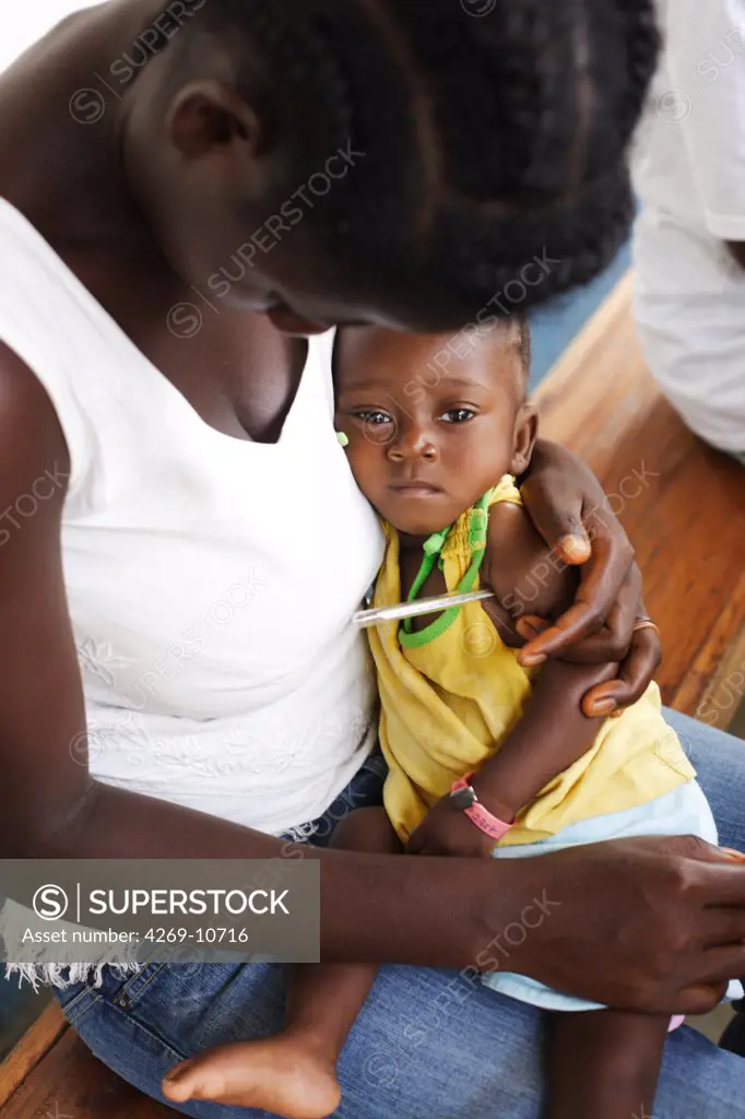 Woman with her child suffering from malnutrition in a Therapeutic Feeding Center in Monrovia, Liberia, implemented by Action contre la Faim (ACF), an international non-governmental organisation (Action against Hunger).