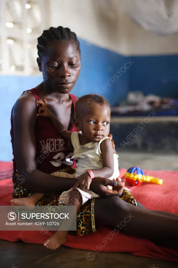 Young mother and her child suffering from malnutrition in a Therapeutic Feeding Center in Monrovia, Liberia, implemented by Action contre la Faim (ACF), an international non-governmental organisation (Action against Hunger).