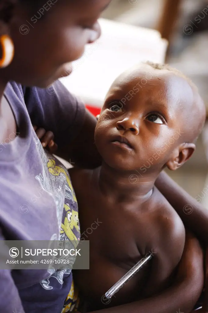 Checking the temperature of children suffering from malnutrition in a Therapeutic Feeding Center in Monrovia, Liberia, implemented by Action contre la Faim (ACF), an international non-governmental organisation (Action against Hunger).