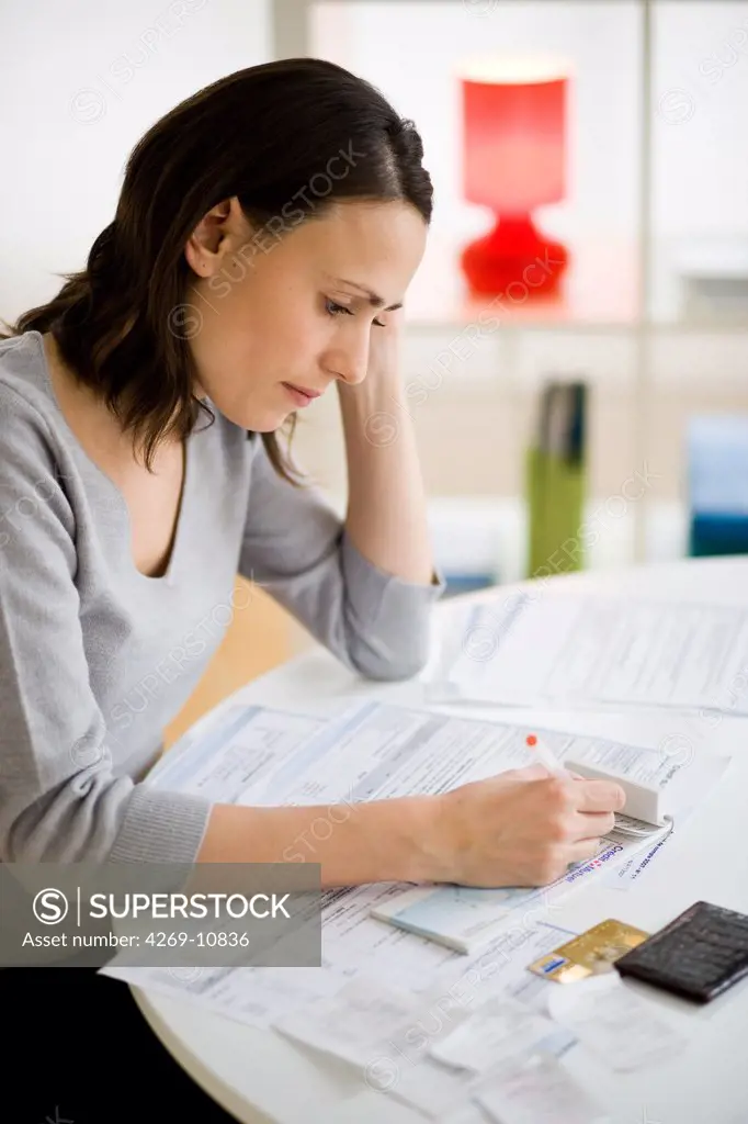 Woman going over paperwork.