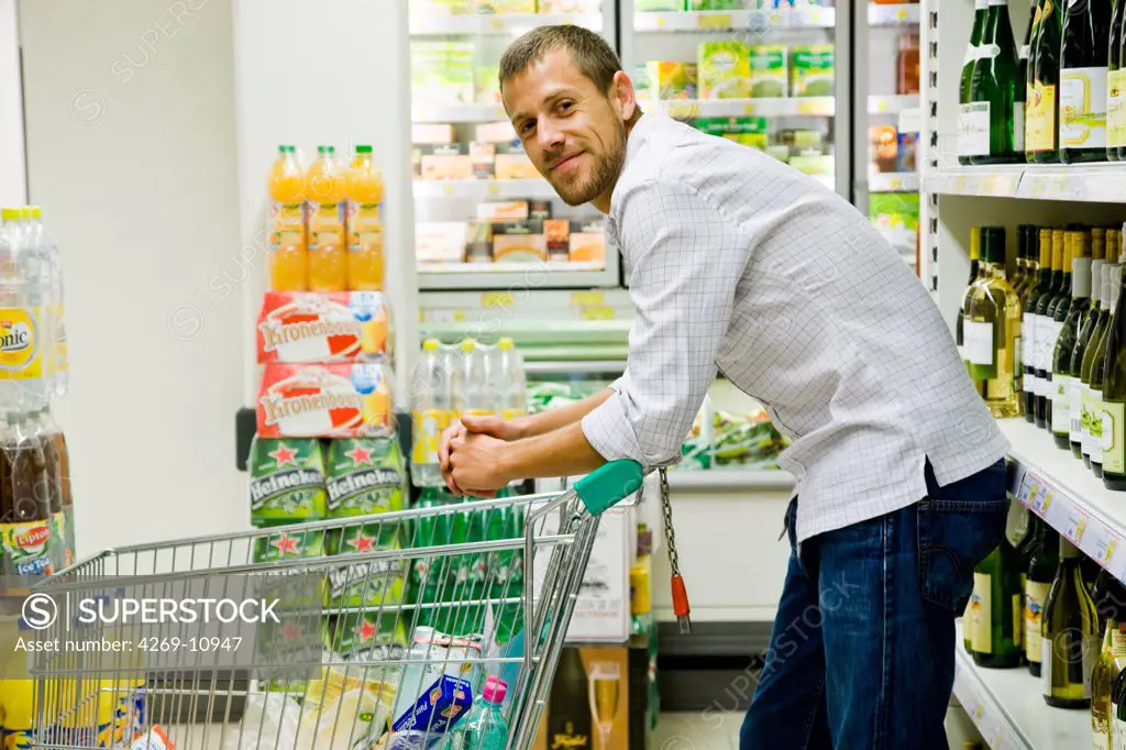 Man shopping in supermarket.
