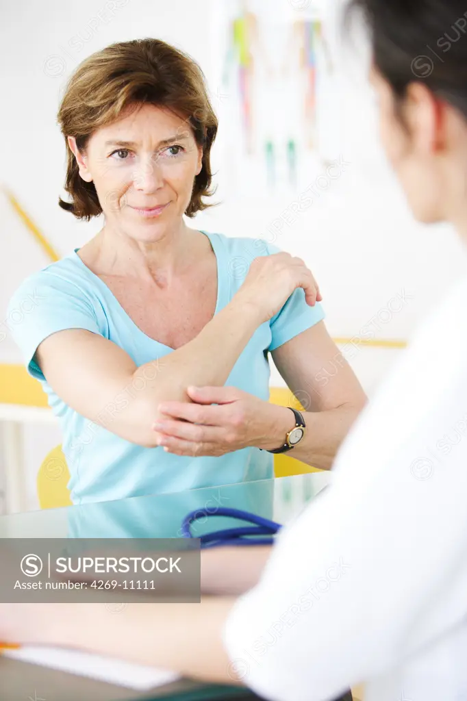 Woman consulting for a painful elbow.