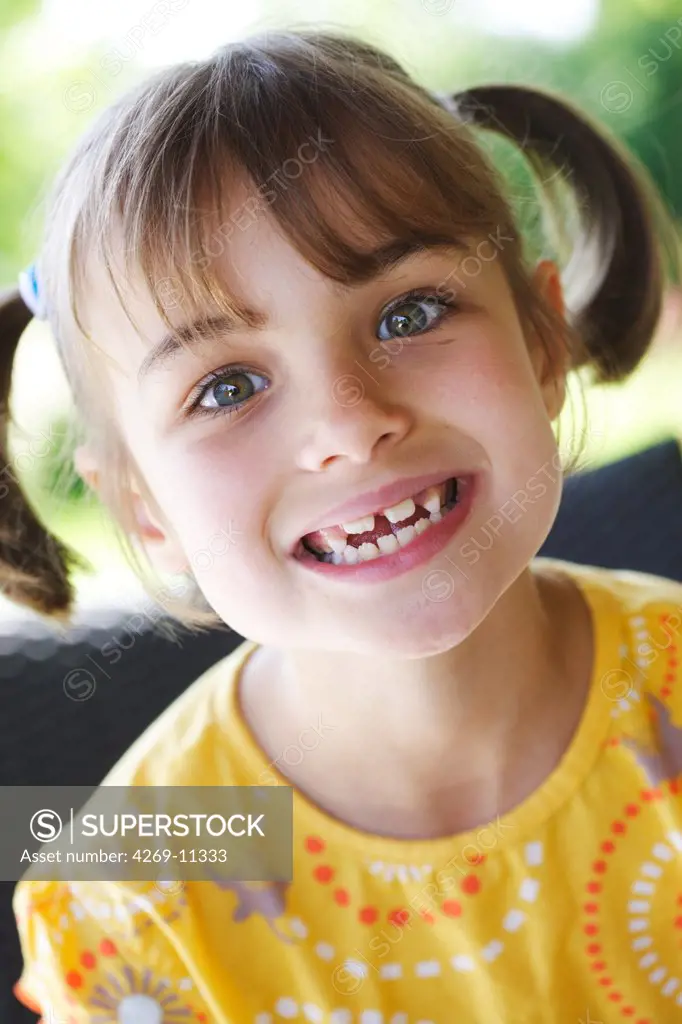7 years old girl with milk teeth.