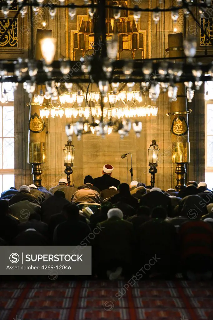 Faithfuls praying in Yeni Cami, the New Mosque, Istanbul, Turkey.