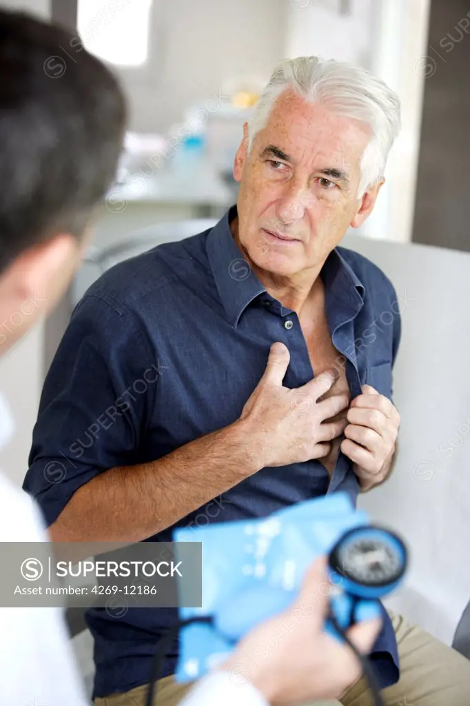 Doctor talking with a senior patient during medical consultation.