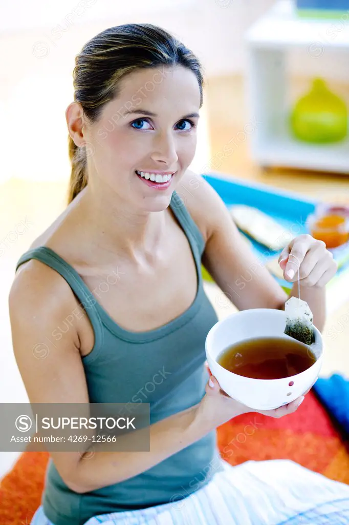 Woman drinking herbal tea.