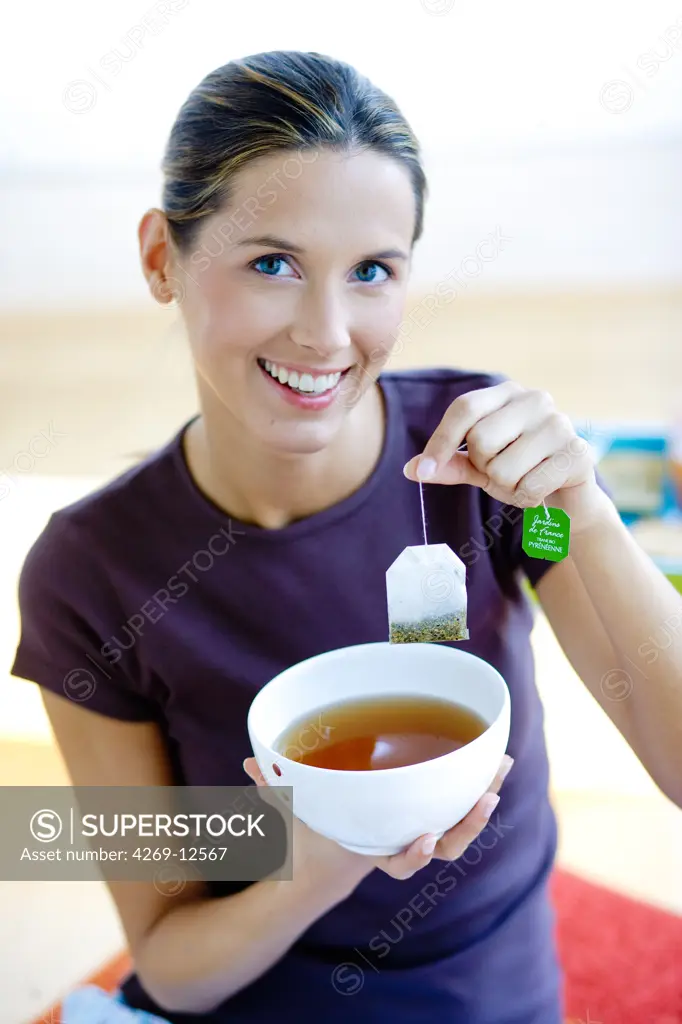 Woman drinking herbal tea.