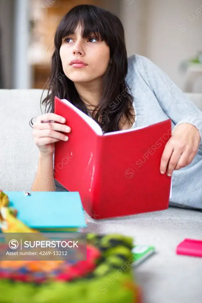 Teenage girl with notebooks.