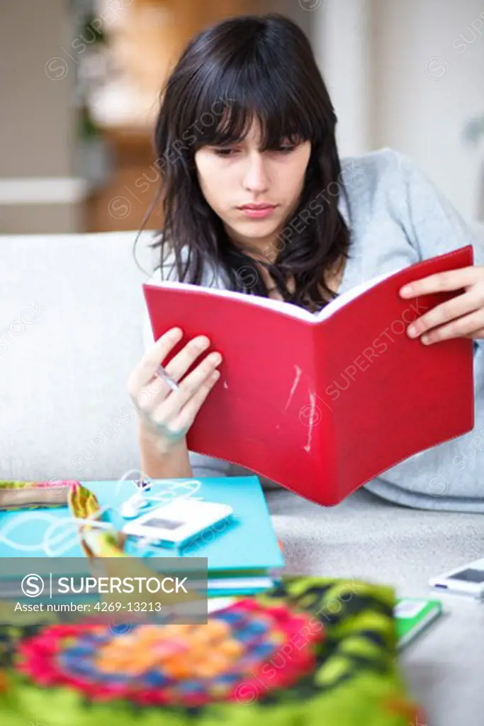 Teenage girl with notebooks.