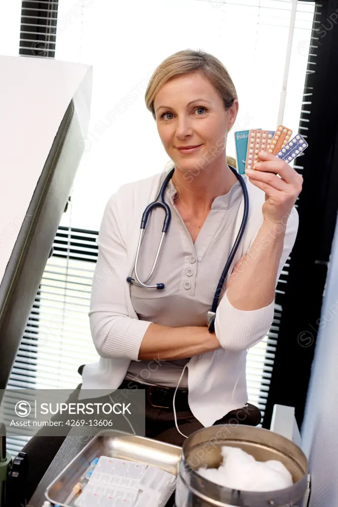 Doctor with various contraceptives.