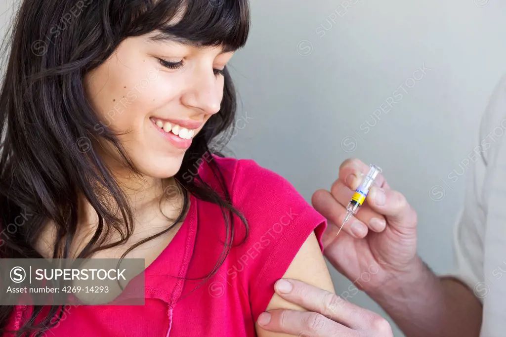 Teenage girl receiving vaccination against Tetanus, Diphtheria and Polio (TdP vaccine)