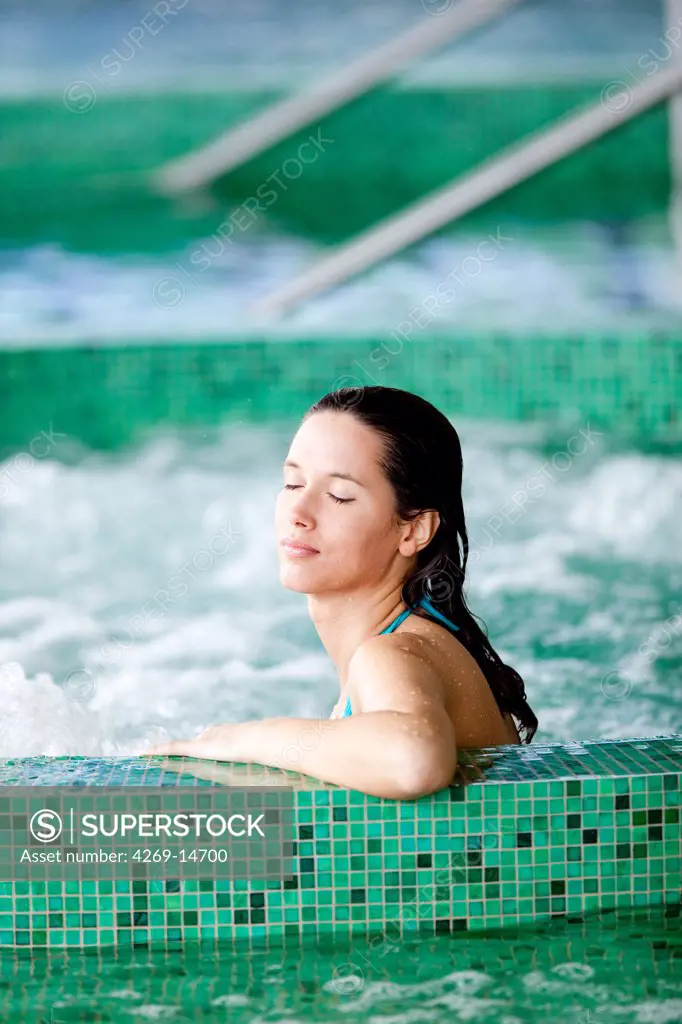 Woman in spa pool.