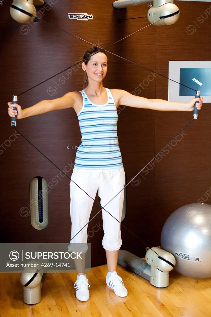 Woman practising pilates exercises.