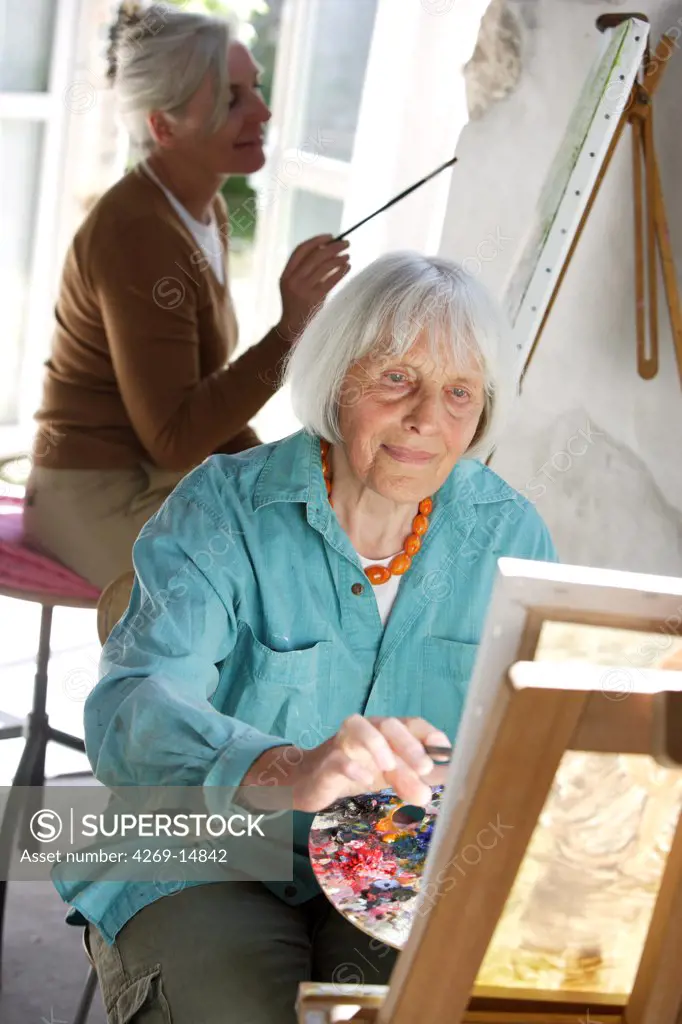 80 years old woman painting.